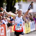 Simona Aebersold celebrates on the finish line.