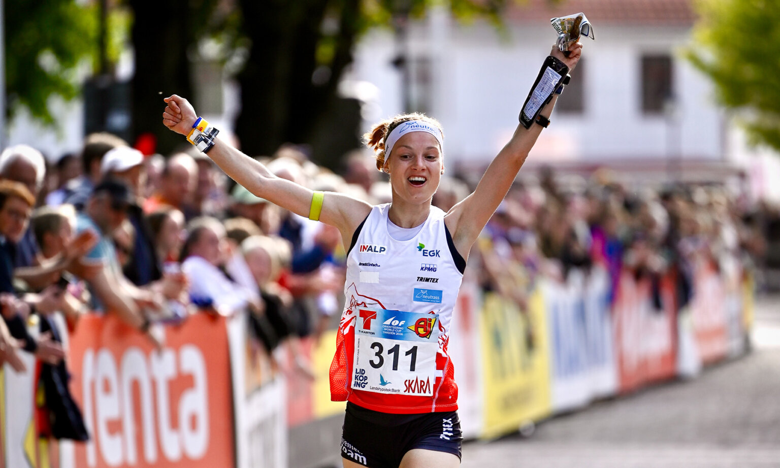 Simona Aebersold celebrates on the finish line.
