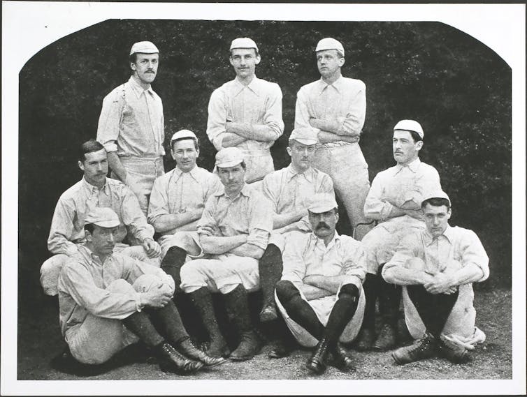 Soccer players pose for a photo.