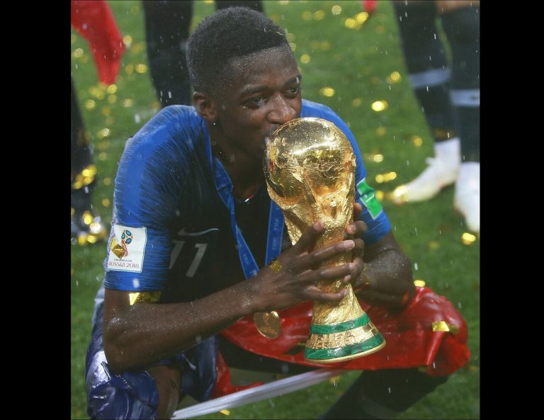 Ousmane Dembélé holding the 2018 FIFA World Cup Trophy #
